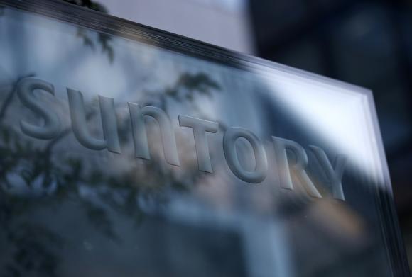 A signboard of Suntory Holdings is displayed at the entrance of Suntory World Headquarters in Tokyo