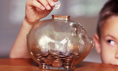 child and piggy bank