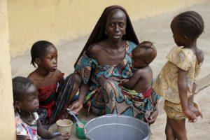 A woman, who was freed by the Nigerian army from Boko Haram militants in the Sambisa forest, feeds her child at the Malkohi camp for internally displaced people in Yola, Nigeria, May 3, 2015.  REUTERS/Afolabi Sotunde