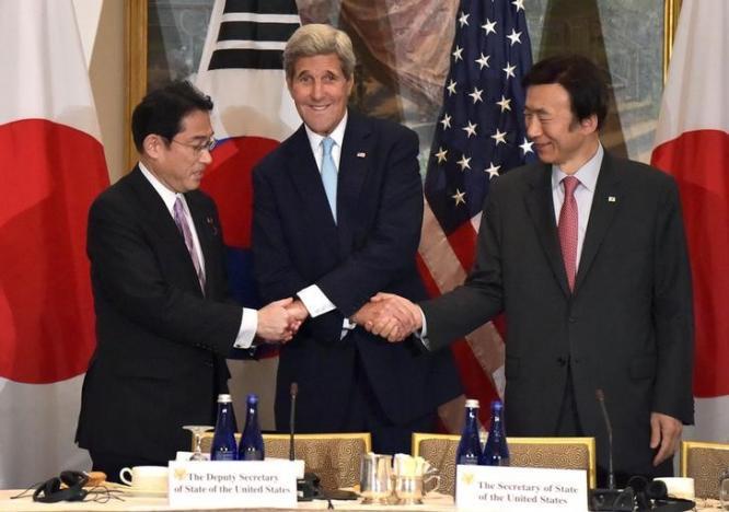 U.S. Secretary of State John Kerry shakes hands with Japan's Foreign Minister Fumio Kishida and South Korea’s Foreign Minister Yun Byung-se before a meeting at the Lotte New York Palace hotel in Manhattan