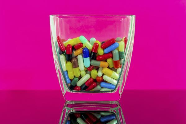 Colorful pills in a large bowl
