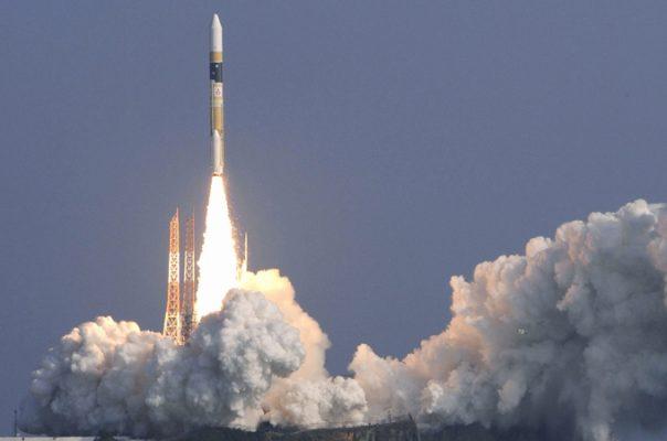 A H-2A rocket carrying Japan's spy satellite blasts off from the launching pad at Tanegashima Space Center