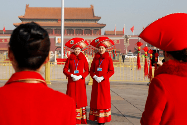 China sets lower GDP target as trade war hits home