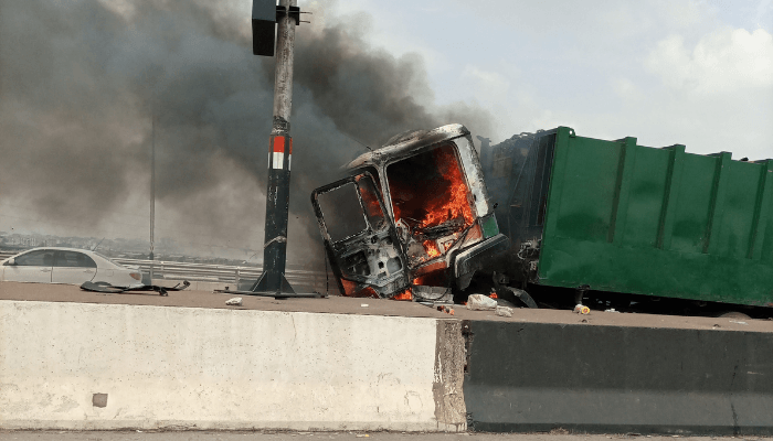 BREAKING: LAWMA compactor up in flames on Third Mainland Bridge