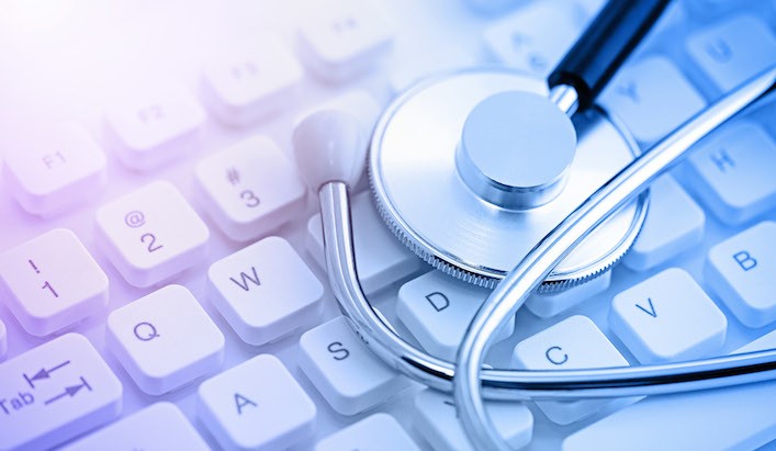Stethoscope on computer keyboard