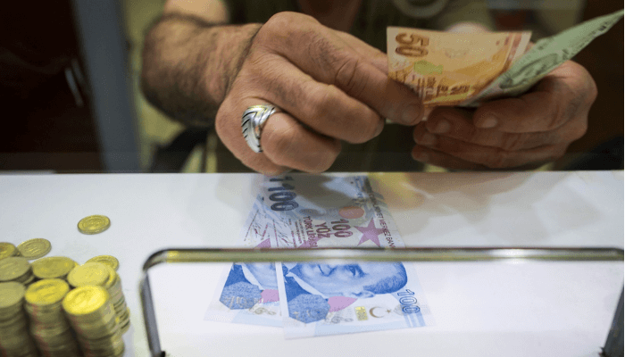 Turkish lira tumbles as Erdoğan backs more orthodox economic team