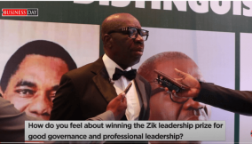 Edo State Governor, Godwin Obasaki receives an award for good governance at Zik Price Award night