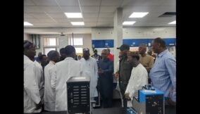 Aliko Dangote conducting reps member around the refinery laboratory