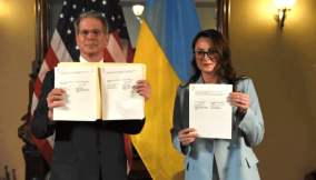 US Treasury Secretary Scott Bessent and Ukrainian Vice Prime Minister Yulia Svyrydenko pose after signing a deal that will give the US preferential access to new Ukrainian minerals deals and fund investment in Ukraine’s reconstruction, in Washington, DC, on April 30, 2025 [Yulia Svyrydenko via Facebook/via Reuters]