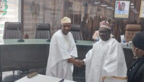 Amupitan swear in Adeniran Tella