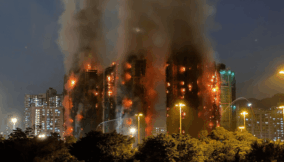 Hong Kong arrests 13 as probe into deadly estate fire widens