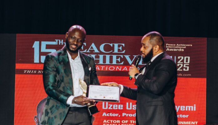 Uzee Usman receives award