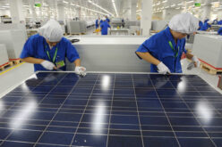 Workers labor in a factory of a Chinese solar panel maker in Hangzhou