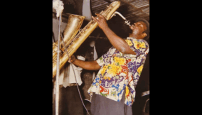 Bobby Benson jamming on his saxophone at The Caban Bamboo, his iconic club, back in 1959