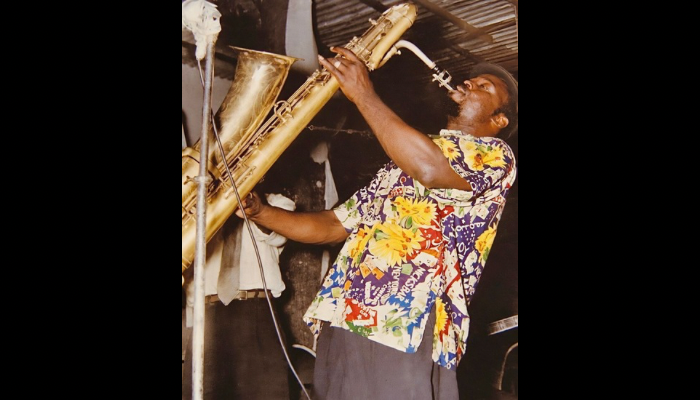 Bobby Benson jamming on his saxophone at The Caban Bamboo, his iconic club, back in 1959