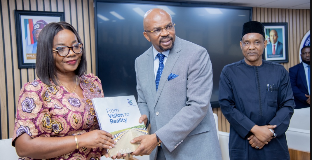 L-R: Nyingi Brown, Head of Service, Rivers State (receiving an award); receiving an award; Boma Iyaye of NDDC presenting the award; Ishiyaku Mohhamed, Permanent Secretary, office of the Head of Service, looking on.